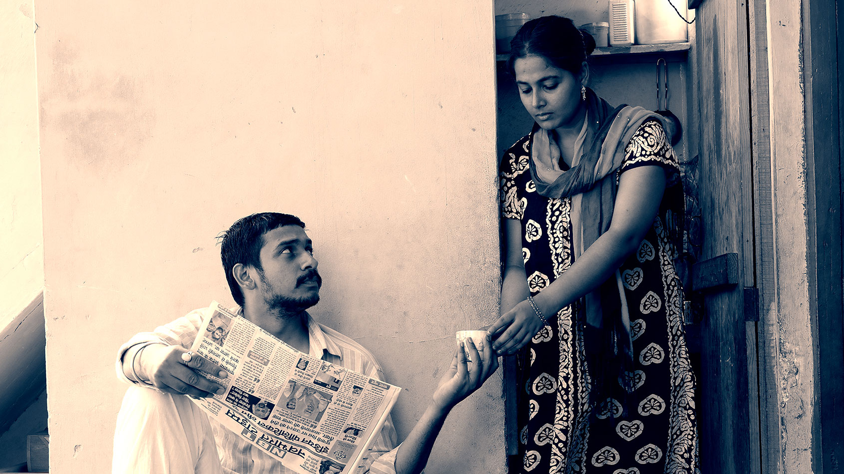 Blog image - A woman serving tea to a man